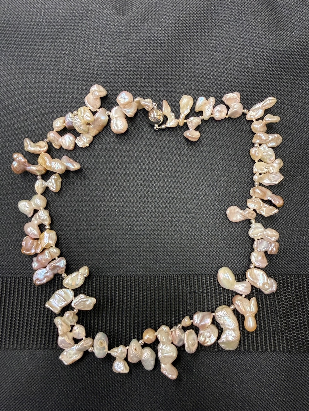 Fresh water pearl necklace with magnetic clasp. Color mostly pale pink. Like new